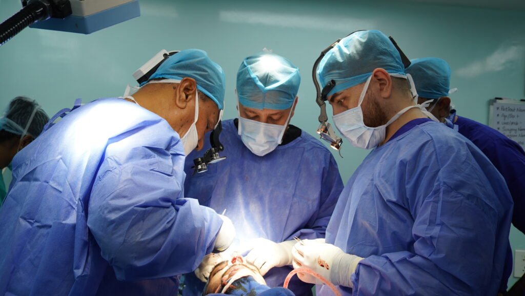 Experienced rhinoplasty surgeons demonstrating advanced tip surgery techniques during a live surgical training session with In OT Assistance, focusing on precision, nasal anatomy, and tip refinement.